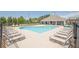 Inviting community pool area with plenty of lounge chairs for residents' enjoyment at 3715 Bridges Ct, Cumming, GA 30040