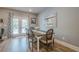 Bright dining area with modern lighting and backyard patio access through French doors at 3715 Bridges Ct, Cumming, GA 30040