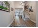 Spacious foyer with beautiful floors, a staircase, and stylish decor, leading to the main living areas at 3715 Bridges Ct, Cumming, GA 30040
