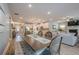 Open concept living space, joining kitchen, dining, and living room in one beautiful, light-filled layout at 3715 Bridges Ct, Cumming, GA 30040