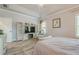 Serene main bedroom with large windows, lots of closet space, and tray ceiling at 3715 Bridges Ct, Cumming, GA 30040