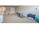 Carpeted playroom area with toys and natural light at 3715 Bridges Ct, Cumming, GA 30040