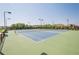 Community tennis courts surrounded by green space and mature trees at 3715 Bridges Ct, Cumming, GA 30040