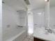 Well-lit bathroom featuring white tile, bathtub, and updated vanity at 6296 Longino Drive, Union City, GA 30291