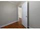 View of the bedroom with hardwood floors and a door leading to another room at 6296 Longino Drive, Union City, GA 30291