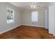 Bedroom with hardwood floors, a window, and a ceiling fan at 6296 Longino Drive, Union City, GA 30291
