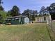 Charming home with a spacious, tree-lined backyard at 6296 Longino Drive, Union City, GA 30291