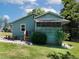 Cozy home with a screened porch and a picnic table outside on a well-maintained lawn at 6296 Longino Drive, Union City, GA 30291