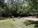 Landscaped front yard with mature trees at 6296 Longino Drive, Union City, GA 30291
