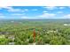 Beautiful aerial view of the home surrounded by lush, mature trees in a peaceful, serene, and park-like setting at 7370 N Mitchell Ct, Villa Rica, GA 30180