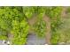 Aerial view of the home showcasing its secluded location, surrounded by lush trees providing lots of privacy at 7370 N Mitchell Ct, Villa Rica, GA 30180