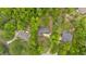 Aerial view showcases three homes nestled among mature trees offering a serene, private living environment at 7370 N Mitchell Ct, Villa Rica, GA 30180