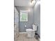 Bathroom with standard fixtures, butterfly-themed shower curtain and tile floor at 7370 N Mitchell Ct, Villa Rica, GA 30180