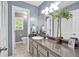Bright bathroom with modern vanity, neutral colors and ceramic tile flooring at 7370 N Mitchell Ct, Villa Rica, GA 30180