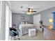 Comfortable bedroom featuring a ceiling fan, neutral colors and ample closet space at 7370 N Mitchell Ct, Villa Rica, GA 30180