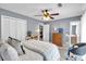 Relaxing bedroom with walk-in closet, dresser, and ensuite bathroom at 7370 N Mitchell Ct, Villa Rica, GA 30180