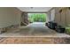 Spacious carport with stone accents, connecting to the home and driveway at 7370 N Mitchell Ct, Villa Rica, GA 30180