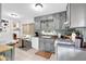 Kitchen with gray cabinetry, tiled floors, and a breakfast nook with window at 7370 N Mitchell Ct, Villa Rica, GA 30180