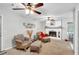Bright living room with plush seating, a fireplace, and a cozy atmosphere, perfect for relaxation at 7370 N Mitchell Ct, Villa Rica, GA 30180