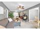 Spacious living room featuring neutral walls, plush carpeting, and a ceiling fan at 7370 N Mitchell Ct, Villa Rica, GA 30180