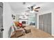 Inviting living room with a cozy fireplace, plush seating, and ample natural light at 7370 N Mitchell Ct, Villa Rica, GA 30180