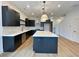 Modern kitchen with an island, stainless steel appliances, and white subway tile backsplash at 919 Hughley Circle # 72, Atlanta, GA 30316