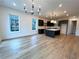 Open concept living room and kitchen layout, featuring wood floors and ample lighting at 919 Hughley Circle # 72, Atlanta, GA 30316