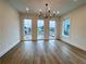 Open living room with wood floors, recessed lights, and large picture windows at 919 Hughley Circle # 72, Atlanta, GA 30316