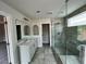 Modern bathroom features a double vanity, glass shower, and stylish tile at 1058 Crest Mill Dr, Marietta, GA 30008