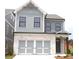 Charming two-story home with a brick-and-siding facade and integrated garage at 1058 Crest Mill Dr, Marietta, GA 30008