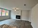 Spacious living room features a sleek fireplace, ceiling fan, and large windows at 1058 Crest Mill Dr, Marietta, GA 30008