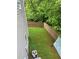 Cozy backyard with a wood fence and green lawn at 107 Providence Run, Dallas, GA 30157