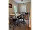 Dining area includes table and chairs near a window with natural light at 107 Providence Run, Dallas, GA 30157