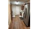 Spacious kitchen featuring stainless steel appliances and light colored walls and trim at 107 Providence Run, Dallas, GA 30157