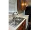 Kitchen featuring stainless steel sink, faucet, and modern cabinetry at 107 Providence Run, Dallas, GA 30157