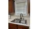 Kitchen featuring stainless steel sink, faucet, and modern cabinetry at 107 Providence Run, Dallas, GA 30157