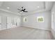 Spacious main bedroom with neutral carpet, trey ceilings, and a view to the bathroom at 3470 Austin Michael Ln, Cumming, GA 30028