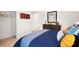 Well-decorated bedroom with closet, a dresser and basketball themed decor, creating an inviting and stylish space at 358 Friendship Oak Way, Hampton, GA 30228