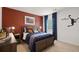 Cozy bedroom with warm tones, a basketball decor, and a comfortable bed creating a fun and inviting atmosphere at 358 Friendship Oak Way, Hampton, GA 30228