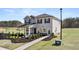 Charming two-story home with a well-manicured front yard and inviting entryway at 358 Friendship Oak Way, Hampton, GA 30228