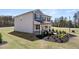 Side view of a well-maintained home with a landscaped yard and a glimpse of a playground at 358 Friendship Oak Way, Hampton, GA 30228