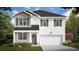 Charming two-story home featuring a two-car garage and beautifully landscaped front yard at 358 Friendship Oak Way, Hampton, GA 30228