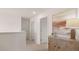 Upstairs hallway featuring neutral walls and trim, showing access to other rooms at 358 Friendship Oak Way, Hampton, GA 30228