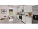 Modern kitchen featuring stainless steel appliances, granite countertops, and ample cabinet space at 358 Friendship Oak Way, Hampton, GA 30228