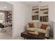 Cozy sitting area with comfortable couch and desk space; perfect for a home office at 358 Friendship Oak Way, Hampton, GA 30228