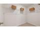 An organized walk-in closet featuring white wire shelving and ample storage space, creating a functional and tidy area at 358 Friendship Oak Way, Hampton, GA 30228
