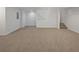 Finished basement area with neutral carpet and staircase to the upper level at 4335 Northwind Dr, Ellenwood, GA 30294