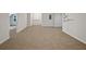 Large finished basement area with neutral carpet and white painted walls at 4335 Northwind Dr, Ellenwood, GA 30294