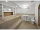 Large primary bathroom featuring a jacuzzi tub, vanity and separate shower at 4335 Northwind Dr, Ellenwood, GA 30294
