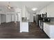 Modern kitchen featuring white cabinets, granite countertops, stainless steel appliances, and an open layout at 4335 Northwind Dr, Ellenwood, GA 30294